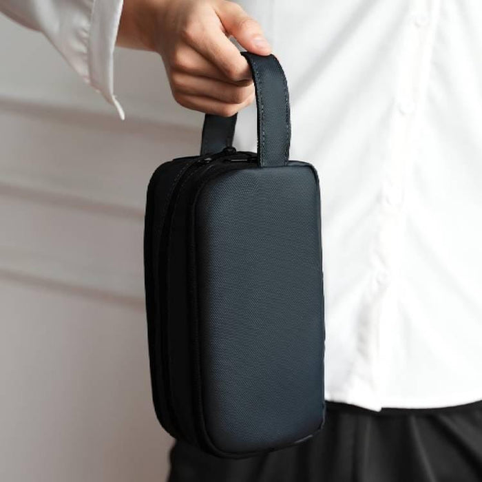 A Person is Holding Multi-Purpose Travel Organizer Pouch.