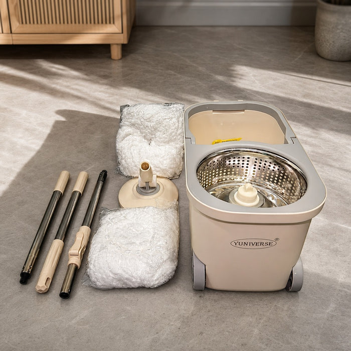 Smart Spin Mop And Bucket with bucket, cloths, and poles on a floor.