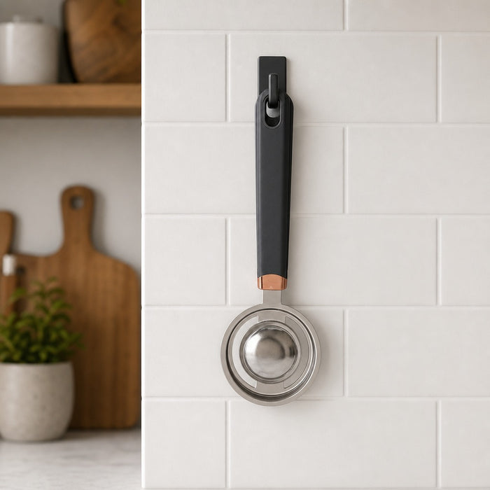 Stainless Steel Egg Yolk Separator is Hanged on the Hook of Kitchen Wall.