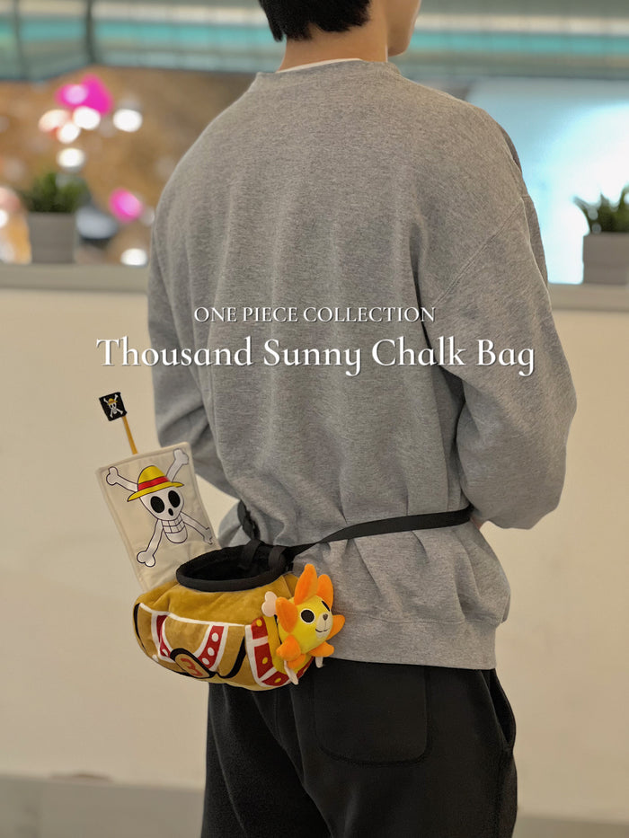 A cute anime plush chalk bag shaped like a famous cartoon pirate ship by Fatworm. This functional lion-headed boat accessory is handmade for bouldering and climbing for rock climbing, featuring a long-durable design that makes a unique climbing gift for any climber.