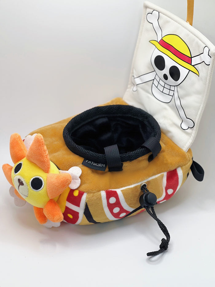 A cute anime plush chalk bag shaped like a famous cartoon pirate ship by Fatworm. This functional lion-headed boat accessory is handmade for bouldering and climbing for rock climbing, featuring a long-durable design that makes a unique climbing gift for any climber.