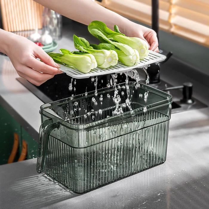 a person washing vegetables over a Fridge Organizer Storage Box
