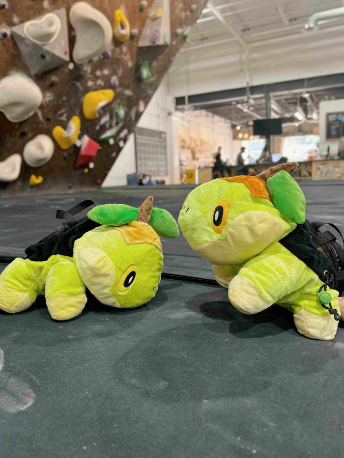A soft and fluffy Turtwig plush chalk bag by Fatworm. This cute yet functional bouldering bag features a long-durable design and character-inspired details, making it the perfect climbing gift for climbers who love unique, handmade accessories.