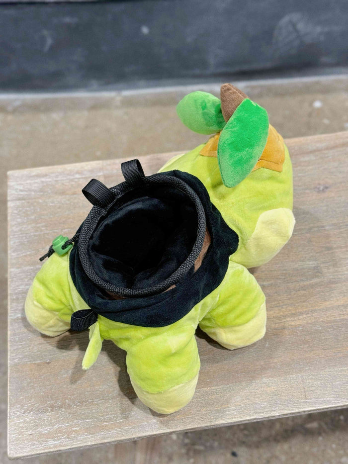 A soft and fluffy Turtwig plush chalk bag by Fatworm. This cute yet functional bouldering bag features a long-durable design and character-inspired details, making it the perfect climbing gift for climbers who love unique, handmade accessories.