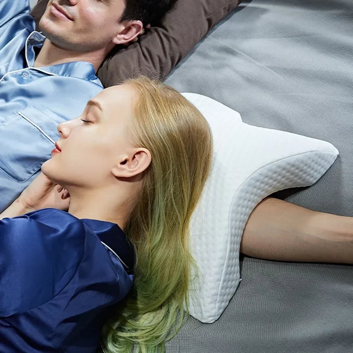 A lady is using a U-Shaped Curved Memory Foam Sleeping Neck Cervical Pillow