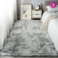 An Ultra Soft Indoor Rug is placed in a room next to the bed