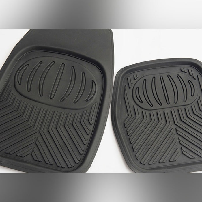 Two black car floor mats with textured surface on a white background