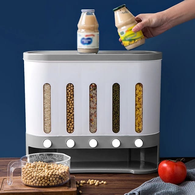 Someone placing a bottle on top of the Wall Mounted 5-Grid Dry Food Dispenser, positioned on the table