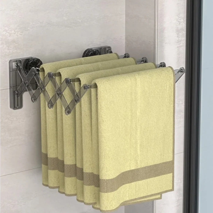 Towels are Hanged on Wall Mounted Foldable Suction Cup Sock Cloth Drying Hanger Rack.