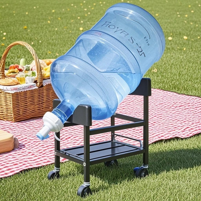 Outdoor picnic setup with a large water jug on a metal stand with wheels.