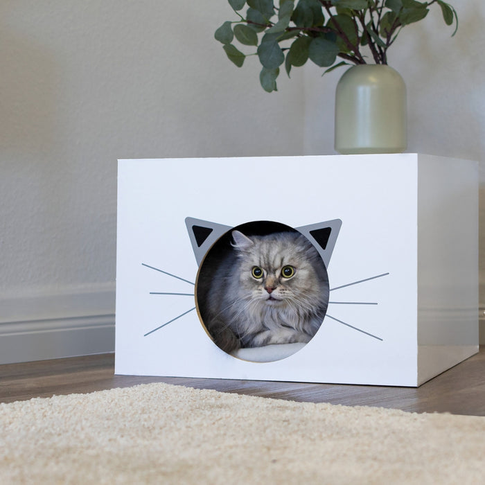 White glossy adhesive vinyl covered box with a cat inside.
