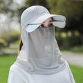 A Woman is Wearing Wide Brim Bucket Hat with Neck Cover.