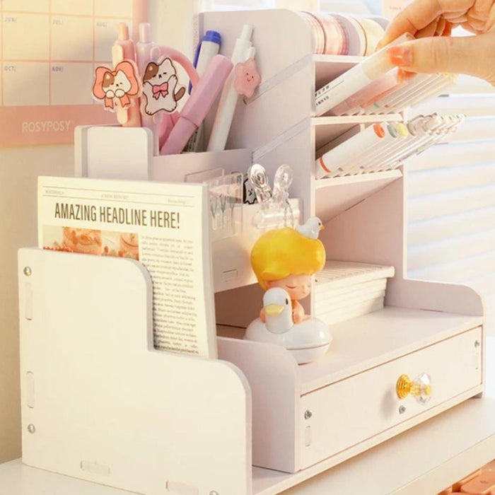 A Person Keeping Marker in a Wooden Stand Organizer.
