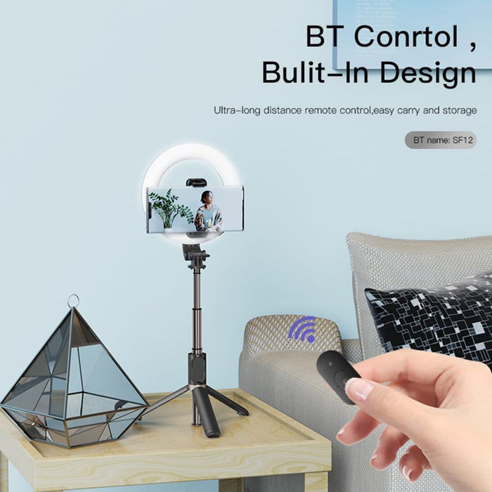 A Person Controls YESIDO Selfie Stick With Wireless Ring Light Tripod With Remote.